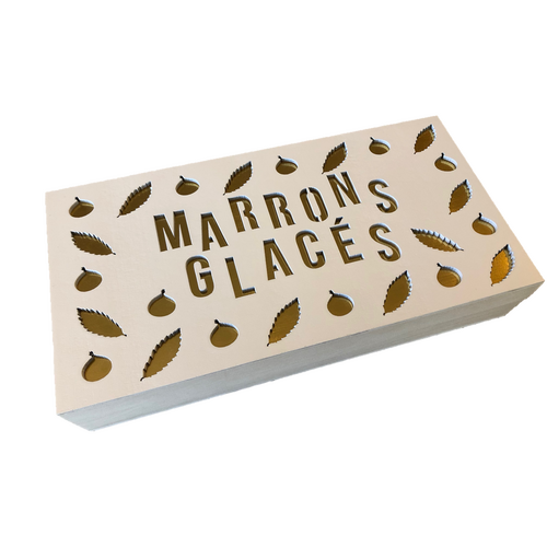 Boite de marrons glacées entiers sous papier or